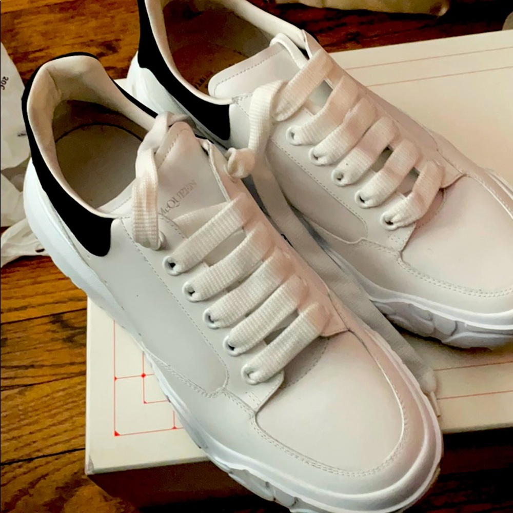 All white Alexander McQueen wide bottoms